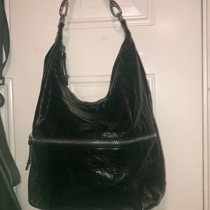 A black shoulder handle bag